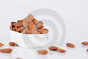 Group of almonds on white background