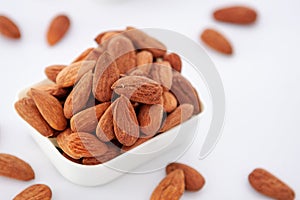 Group of almonds on white background