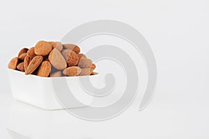 Group of almonds on white background