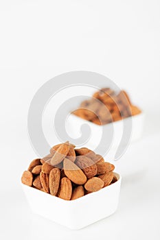 Group of almonds on white background