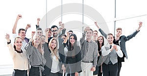 Group of ambitious young people standing in a new office