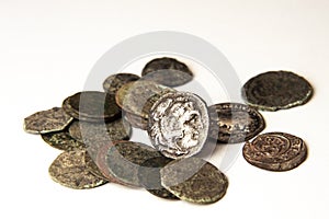 Group of ancient greek coins on white