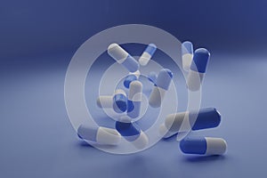 A group of antibiotic pill falling on a blue background. Healthcare and medical 3D concept