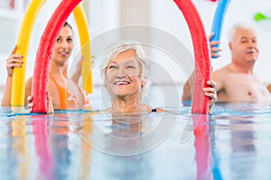 Group in aquarobic fitness swimming pool