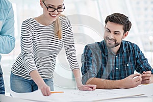 Group of architects discussing plans in modern office