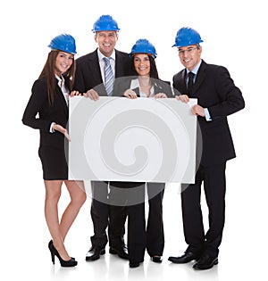 Group of architects holding placard