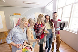 Group of artists taking selfie at art school