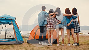 Group of Asia best friends teenagers have fun look at nice sunset view enjoy happy moments together beside camp and tents in