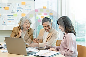 Group of  Asian business working together in a modern office.