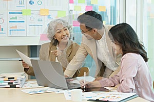 Group of  Asian business working together in a modern office.Talk to colleagues about new startup projects.