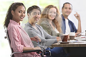 Group of Asian and caucasian businessmen is meeting his work. An