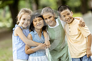 Group of asian and caucasian kids having fun in the park