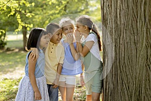 Group of asian and caucasian kids having fun in the park