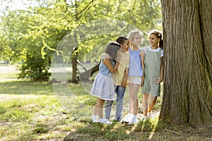 Group of asian and caucasian kids having fun in the park