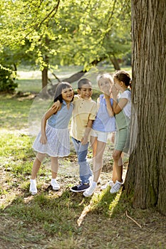 Group of asian and caucasian kids having fun in the park