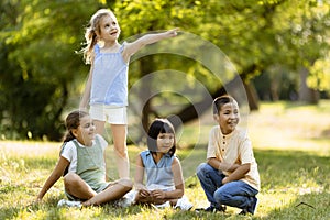 Group of asian and caucasian kids having fun in the park