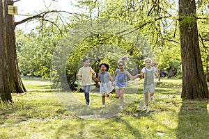 Group of asian and caucasian kids having fun in the park