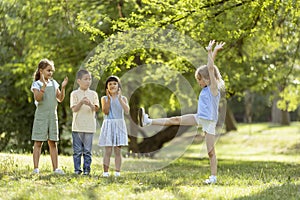 Group of asian and caucasian kids having fun in the park