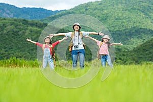 Group asian family children raise arms and standing see mountain outdoors, adventure