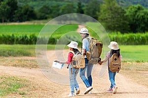 Group asian family children walking in the jungle adventure camping. Student tourism traveling destination leisure trips for educa photo