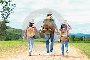 Group asian family children walking in the jungle adventure and tourism for destination and leisure trips for education and relax photo