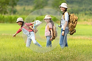 Group asian family children walking in the jungle adventure and tourism for destination and leisure trips for education and relax photo