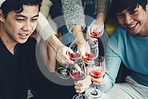 Group of asian friends enjoy having party and drinking wine together