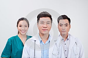 Group of Asian medical workers doctors and nurse smiling at camera