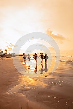 a group of Asian teenagers running with happy expressions on vacation with their friends drunk on the beach