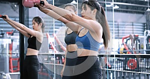 Group asian women training exercise workout at fitness gym in sportswear with personal trainer