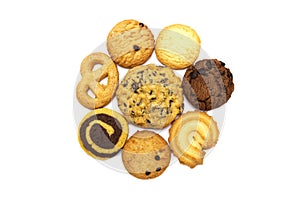 A group of assorted cookies. Chocolate chip, oatmeal, raisin and biscuits in the shape of a spiral pattern isolated on white backg