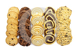 A group of assorted cookies. Chocolate chip, oatmeal, raisin, Coconut cream and biscuits in the shape of a spiral pattern isolated