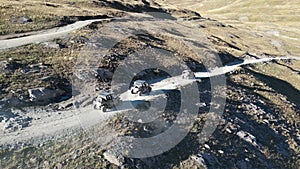 Group of atv's driving down dirt road