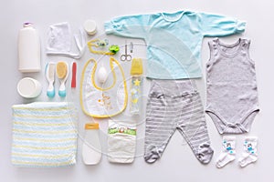 Group of baby boy clothes and equipment.