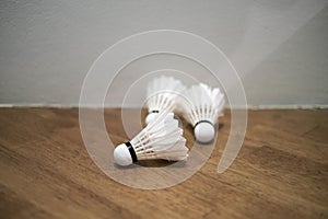 A group of badminton Shuttlecocks are scattered.