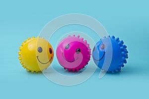 Group of balls with smiling faces on blue background