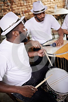 Group, band and music on drums for carnival, festival or creative performance at party in Brazil. Night, club and