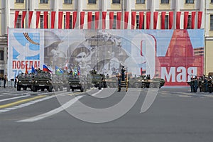 Group with banners on cars UAZ-469 at the head of a column of military equipment