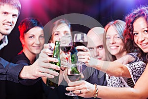 Group of beautiful young friends at the nightclub.