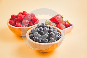 Group berry mix - strawberries, raspberries and blueberries of nature fruit in wood bowl, healthy food for diet