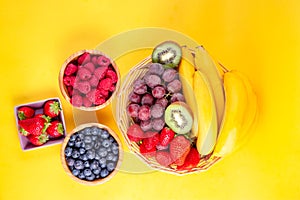 Group berry mix - strawberries, raspberries and blueberries of nature fruit in wood bowl, healthy food for diet