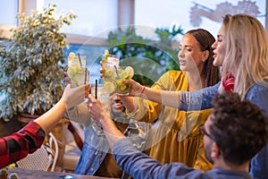 Group of best friends toasting and partying together