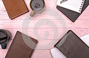 Group Bible Study with Coffee on a Pink Wooden Table