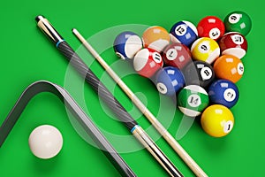 Group of billiard colored balls, cues and triangle