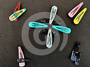 Group of Black ,red color and Color pattern hair clips
