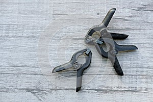 group of black spring tools on grey table