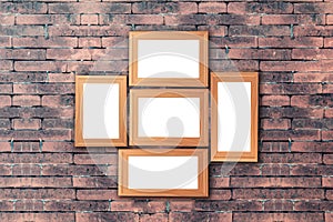Group of blank wood picture frame on the old brick wall with cop