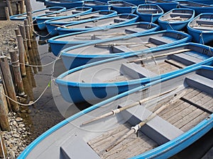 Group of blue rowboat at river