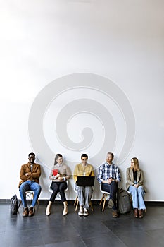 Group of bored people waiting for the job interview