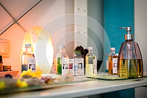 Group of bottles with lotions, at a therapy center